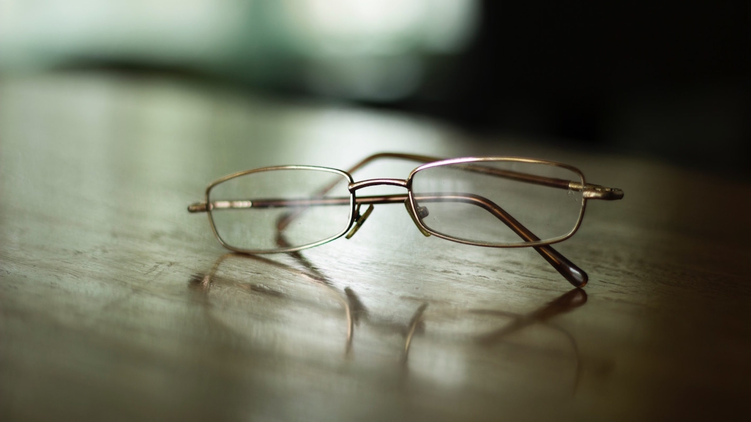 Image of Eye Glasses Sitting On A Table 