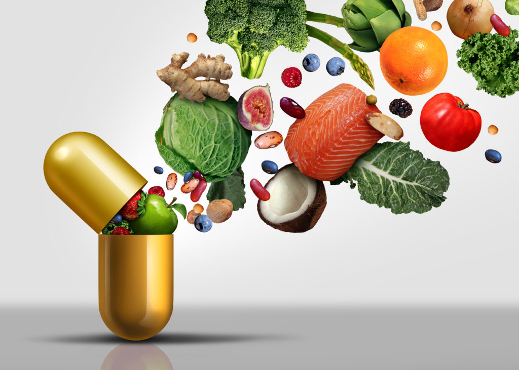 Food going into vitamin capsule