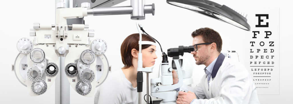 Optometrist examining patients eye